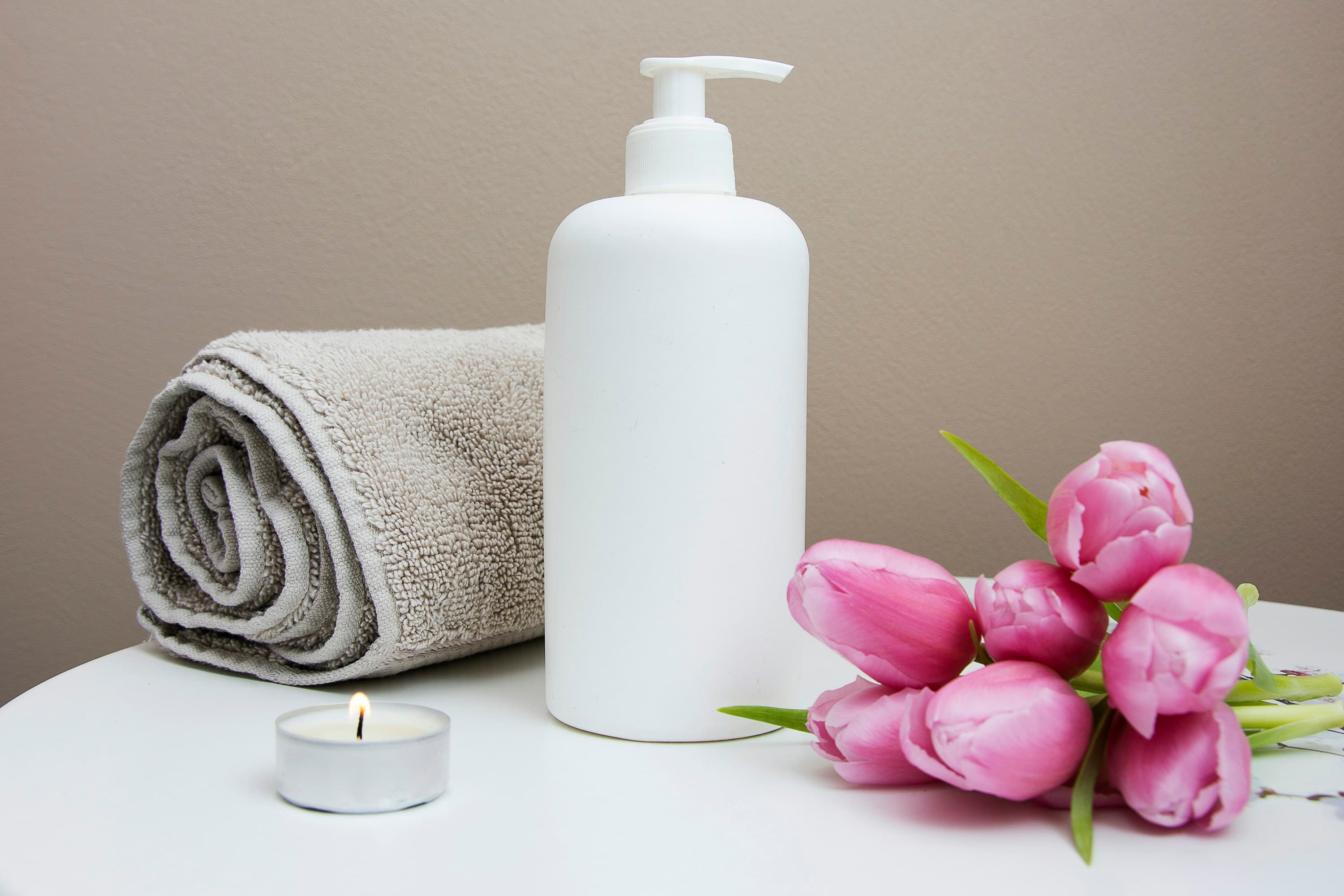 Massage therapist working on a client at a spa