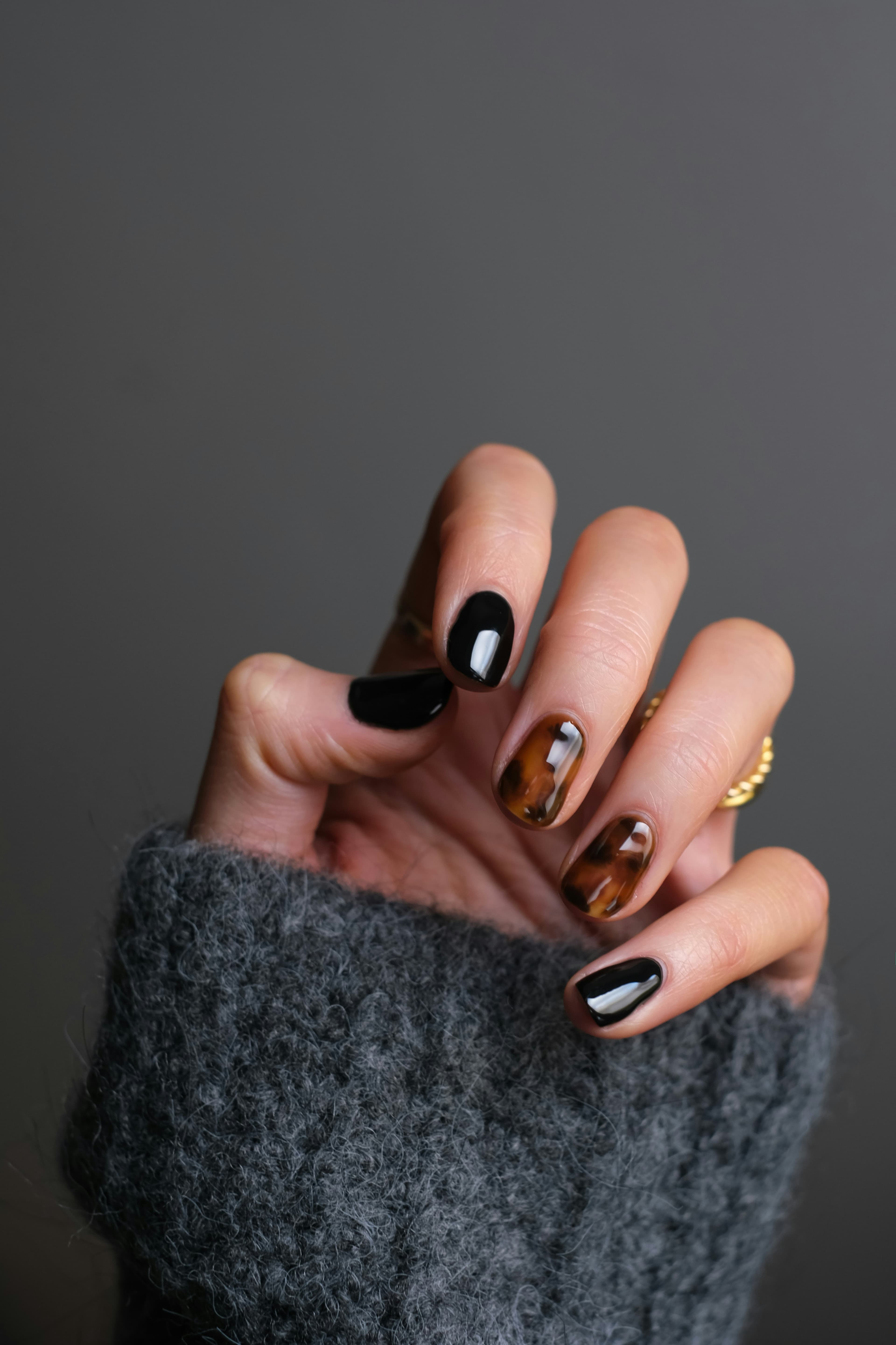 Close-up of a hand showing intricate nail art