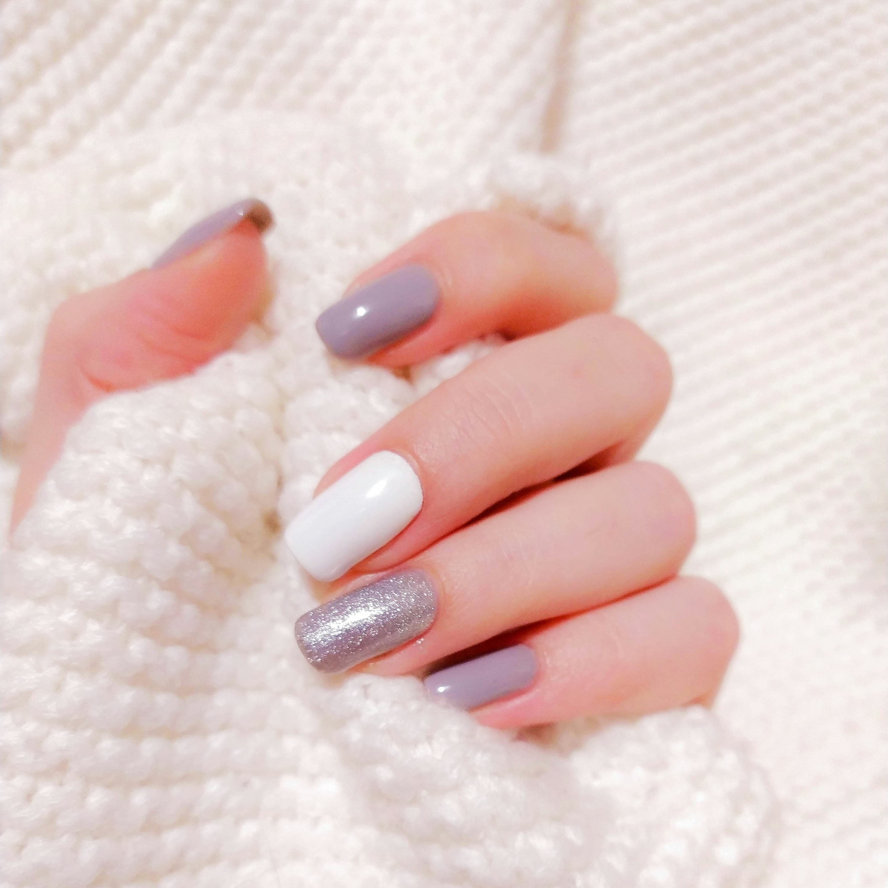 Hand with detailed nail design close-up
